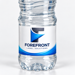 Illustrative detail of a ForeFront custom white label on the lower label band of a ridged ESKA 500 mL bottle